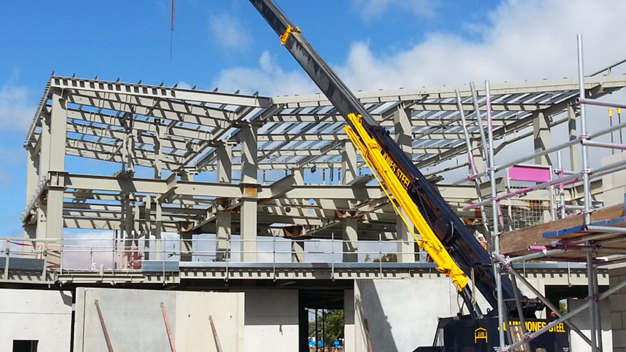 Steel frame under construction with crane, Christchurch rebuild